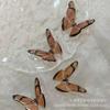 Nuevo gel de lujo de alta calidad, mariposa simétrica con caída de lámina dorada estéreo, accesorios de nicho de tiro Gumei hechos a mano