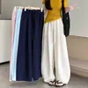 Pantalones de pierna ancha finos de moda versátiles para principios de otoño con cordón cintura elástica pantalones simples de cintura alta adelgazantes pantalones curvos pantalones casuales para mujer