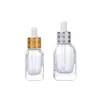 Atacado de fábrica frasco quadrado transparente espesso para óleo essencial frasco de sub-embalagem cosmética frasco conta-gotas frasco de essência frasco de vidro vazio