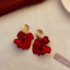 Pendientes de aguja plateada con borla roja, pendientes retro Joker de alto sentido, nuevos pendientes de diseño nicho, pendientes al por mayor de fábrica para mujer