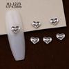 Nuevos accesorios de aleación para decoración de uñas con forma de corazón torcido tridimensional liso con diseño de amor hueco retro japonés