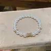 Pulsera de perlas con lazo de doble capa estilo vintage francés, diseño único y versátil, joyería de lujo ligero y de alta gama