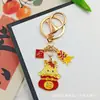 Llavero Colgante Año Nuevo 2026 Metal Zodiaco León Dorado Petardo Despertar Bolsa de la Fortuna Colgante Evento Pequeño Regalo