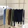 Camiseta base multicolor de cuello bajo y manga larga, versátil para otoño e invierno, disponible en azul marino, gris café, azul y verde vintage