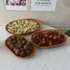 Plato de fruta creativo al por mayor tejido a mano imitación ratán plato de fruta cesta de pan para bocadillos de fruta ovalada cesta de fruta Cesta de fruta tejida de ratán