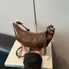 Bolsa de axila da moda, bolsa única estilo coreano bolinho, novo modelo de verão 2026, bolsa de ombro transversal casual simples de cor sólida