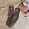Calcetines de tela de color liso para otoño e invierno con bordes rizados, calcetines versátiles de media pantorrilla estilo preppy, calcetines de algodón puro Zhujie para otoño e invierno