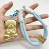 Nuevo Estilo Shuibei Oro Imitación Lotso Oso de Fresa Llavero Colgante para Teléfono Colgante para Bolso Dibujos Animados Estilo Simple