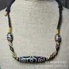 Colar de contas feito à mão com contas dzi de nove olhos do Tibete, corrente para clavícula com dente de tigre e pingente dzi com padrão de deus da fortuna