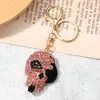 Pingente Chaveiro Caveira Cravejada de Diamantes Estilo Punk Doce e Descolado, Chaveiro de Carro e Pingente de Bolsa Moderno e Criativo