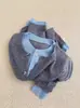 Elegante chaqueta de punto tipo cárdigan gris de dos piezas falsas para mujer, única y chic, adecuada para primavera y otoño, con un suéter y una camiseta básica en el interior