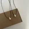 Collar Minimalista con Colgante de Gota de Agua 2025 Nuevo Diseño de Nicho Cadena Versátil para Suéter Caída/Invierno Ajustable
