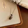 Novo Colar com Pingente Circular Estilo Chinês e Corda Trançada para Mulheres, Design de Nicho, Acessório de Corrente Longa Estilo Retro Minimalista Simples e Moderno