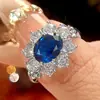 Nuevo Producto 2026 Joyería Huabi Cobre Chapado en Oro Transmisión en Vivo Venta Caliente Corindón Simulado Anillo Simple con Forma de Huevo Piedra Principal 7*9