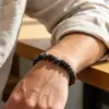 Pulsera de piedra ojo de tigre natural estilo vintage transfronterizo europeo y americano para hombre, cuentas hechas a mano de cáscara de coco personalizadas y de alta gama