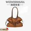 Bolso de Axila de Nicho de Alta Gama Transfronterizo para Mujer Nuevo Estilo 2026 Bolso Tote Simple de Moda Bolso Versátil de Mano para Viajar