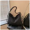 2026 nuevo bolso de hombro de lona de lunares de alta gama de nicho con lazo, bolso de mano de nicho, bolso de axila, bolso cruzado