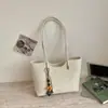 Bolso de mujer de color liso retro de nicho 2026 nueva versión coreana bolso tote simple casual de gran capacidad para el hombro de uso diario