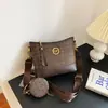 Bolsas femininas populares deste ano 2026 nova tendência moda retrô estampada bolsa transversal tipo balde bolsa de ombro de grande capacidade