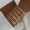 Moda Europea y Americana Nuevo Estilo Moda Personalizada Grabado Trenzado Geométrico Multicapa Apilados Pulseras Set de 10 Piezas Accesorios Al por Mayor