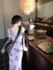 Vestido largo elegante vintage francés morado floral estilo Hong Kong impresionante nuevo vestido de malla estampada otoño 2026