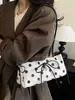 Bolso de axila de lunares estilo coreano, nicho súper popular para mujer, nuevo modelo otoño 2026, bolso de hombro exquisito y elegante, versátil para el trabajo