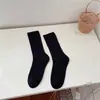 Nuevos calcetines de Otoño e Invierno para mujer Corea del Sur Dongdaemun calcetines de felpa de línea gruesa calcetines de media pantorrilla de moda ins calcetines estilo MIU de rayas verticales