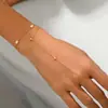 Pulsera de Acero Inoxidable Chapado en Oro Estilo Ins Transfronterizo de Lujo Ligero con Circonita de Gota de Agua y Perla de Agua Dulce Cadena Delicada para Dedos para Mujer