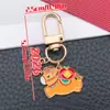 Saludos de Año Nuevo 2025 Palabras Aceite Rojo Goteando Ping An Feliz Caqui Ruyi Rico Llavero Bolso Joyería