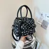 Bolso de mano de moda transfronterizo con lunares frescos, bolso tipo concha versátil de diseño nicho y moderno, bolso cruzado casual dulce con estampado floral