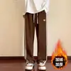 Pantalones de pana a rayas para hombre, forrados de polar y engrosados para otoño e invierno, pantalones casuales de pierna recta holgados para hombre