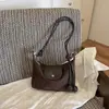 Bolso de axila de estilo francés de nicho transfronterizo para mujer, nuevo bolso de moda tipo albóndiga de gamuza para el trabajo, bolso de hombro y cruzado casual