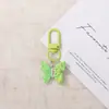 Llavero de mariposa de resina de colores dulces, colgante de hebilla de puerta, producto terminado creativo hecho a mano DIY, decoración de accesorio para bolso