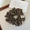 Goma para el pelo de moda y de alta gama estilo coreano con estampado de leopardo para mujer, goma pequeña versátil para coletas altas y peinados de moño