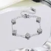 Pulsera de trébol de cuatro hojas de doble cara con incrustaciones de diamantes del fabricante, joyería de acero de titanio 18k para mujer de la suerte, no se decolora, producto más vendido transfronterizo