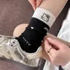 Calcetines de lana para mujer, lindo bordado de gato de dibujos animados, de longitud media hasta la pantorrilla, con un moño, cálidos y que retienen el calor, perfectos para otoño e invierno