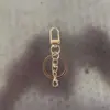 Chaveiro de fivela de porta giratória, corrente de quatro seções, fivela em oito, pingente de conta, decoração de bolsa, chaveiro, acessórios de chaveiro