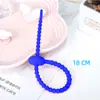 Venta al por mayor de fabricantes de bridas de datos multifuncionales con diseño de hebilla tipo pasador reutilizable para cables de red, hechas de silicona