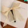 Pinza para el Cabello de Tela Plegada Estilo Coreano de Alta Gama Modelo Nuevo 2025 Pinza Elegante para Cola de Caballo Alta de Niña para Mujeres