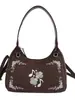 Otoño e invierno 2026 bolso de mano fresco, bandolera, bolso versátil para el trabajo, bordado retro de trébol de cuatro hojas y nota musical, bolso artístico para mujer