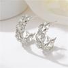 Moda europea y americana de alta gama moda ins aretes 925C personalidad aretes de circonita lazo aretes de aguja de plata al por mayor