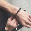 Elementos europeos y americanos Marca Tide pulsera de mancuernas negro brillante pareja pulsera Joker esmerilada fitness cuentas de piedra volcánica al por mayor