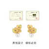 Flor de Caramelo Original Rocío~Micro-incrustación Zirconio Esmalte Gota Esmaltada Aguja de Plata Flor Amarilla Clara Pendientes Yiwu Clavo de Oreja Joyería