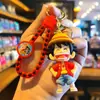 Llavero tejido de una pieza lindo de dibujos animados muñeco de Luffy Sauron colgante de llavero cadena de llaves pareja