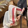 Pantalones deportivos de pierna ancha a rayas estilo americano 2026, seda de hielo de secado rápido, pantalones largos holgados de verano para hombre, pantalones casuales de pierna recta, marca de moda