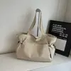 Bolsa tote simples da moda feminina design de nicho estilo Harajuku textura bolsa de ombro para o dia a dia bolsa de mão cor Maillard
