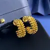 Moda Punk Callejera Europea y Americana Versátil Textura Metálica Remache Cuadrado Bala Forma de C Aros Redondos Clavos