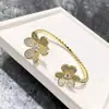 Pulsera de Borde de Perlas de Diamante Incrustado con Doble Flor de Venta Caliente Transfronteriza Europea y Americana Trébol Flor de Seis Pétalos Apertura Pulsera de Nicho Pulsera