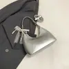 Bolsa balde minimalista de mão, novo modelo da primavera de 2026, alto apelo estético, bolsa de ombro moderna e estilosa, bolsa transversal de nicho da moda