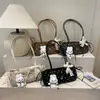 Bolso de axila de estilo coreano, nicho, dulce con lunares para mujer, nueva colección de otoño 2026, moderno bolso de hombro con lazo de encaje